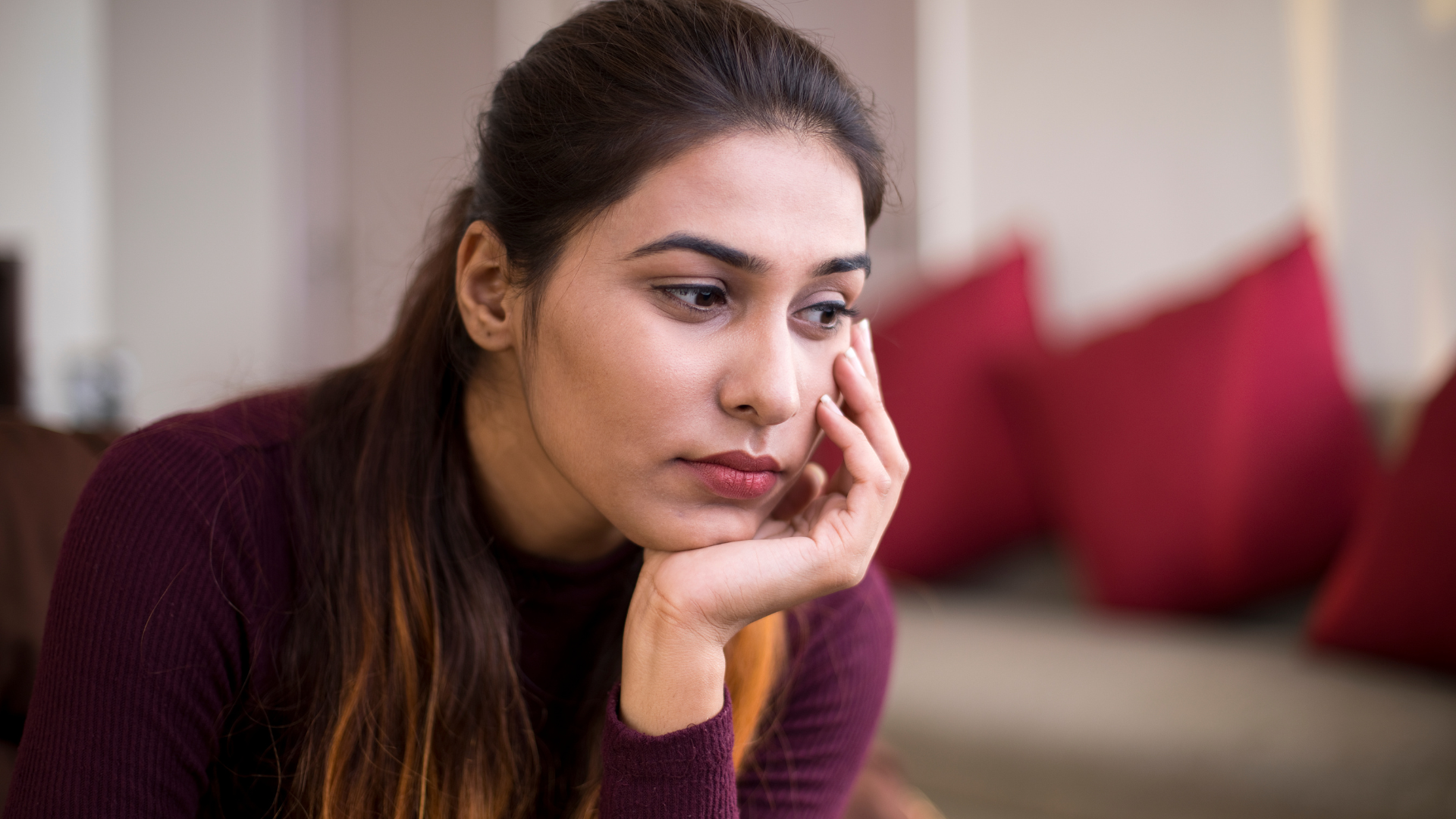 Thinking woman in home environment (FDV)