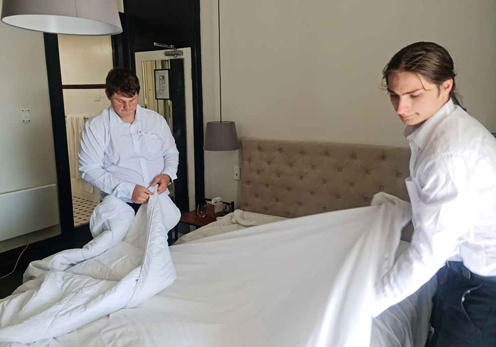 Photo of two men as part of the Hotel Etico program.